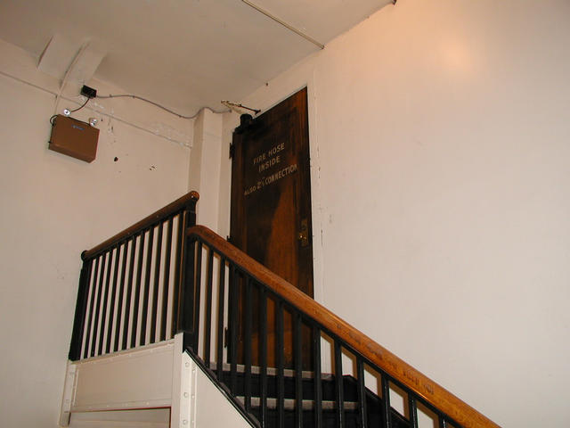 The door to the attic at the top of the stairs.