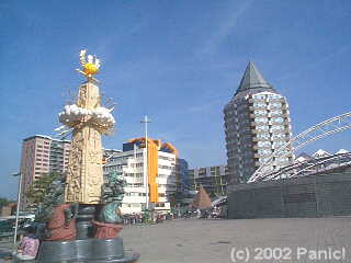 Central Rotterdam with statue and  buildings.