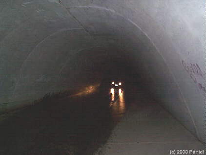 Car lighting up tunnel